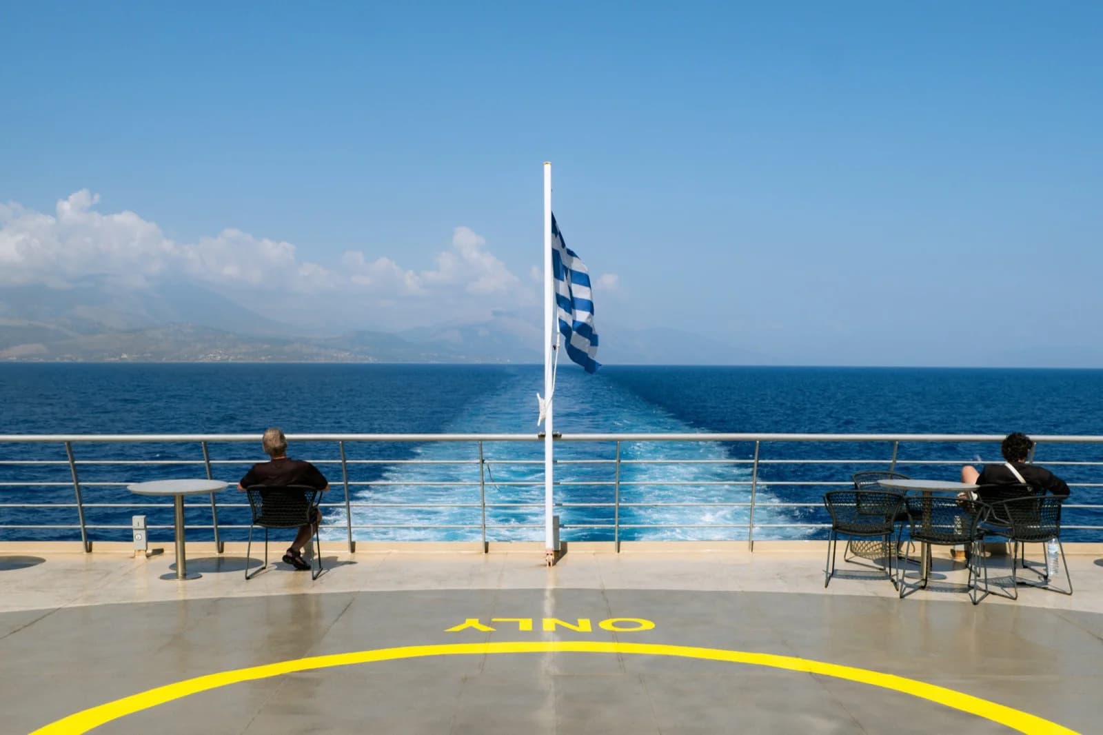 Ferry crew mooring at a Greek island port
